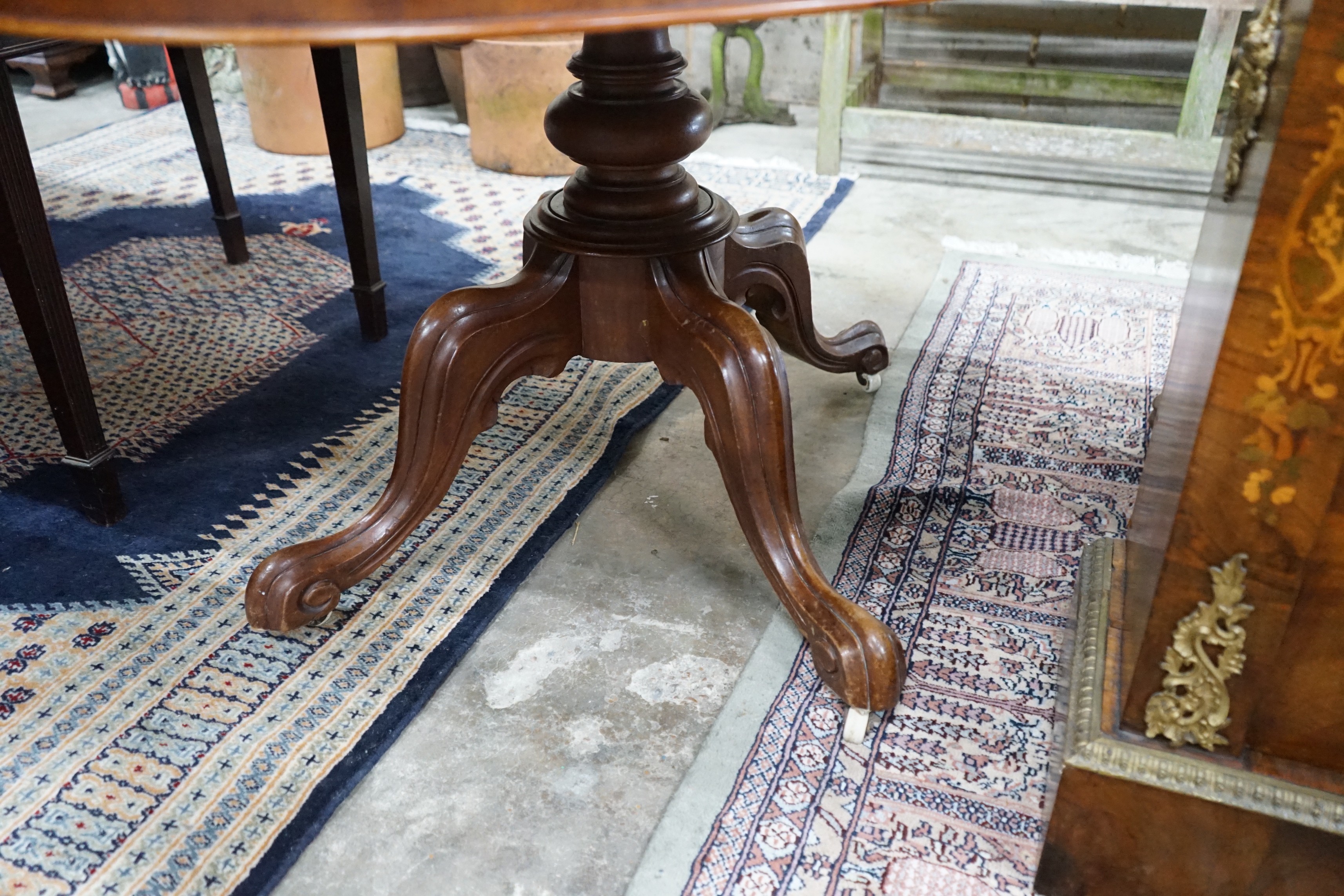 A Victorian mahogany oval tilt-top loo table width 134cms, depth 104, height 72cms.